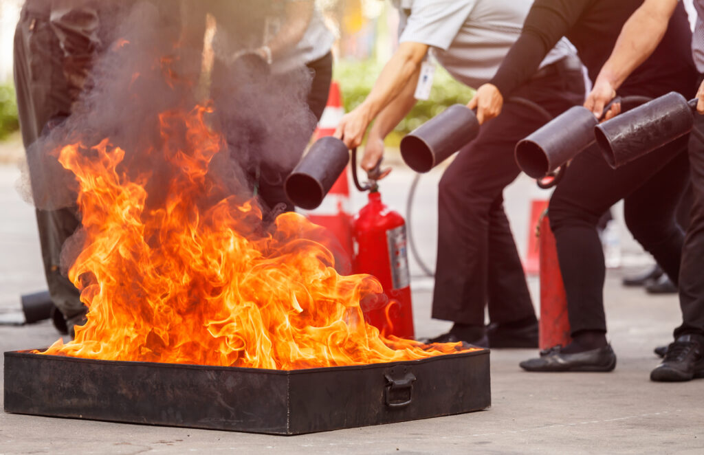 people in the conflagration preventive extinguisher training program, safety concept